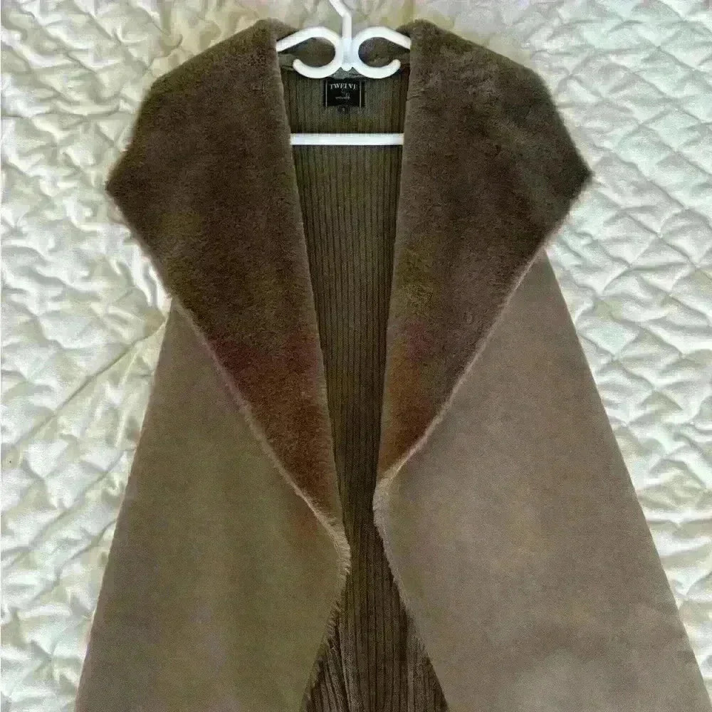 Woman’s fur coat  jacket in dark brown